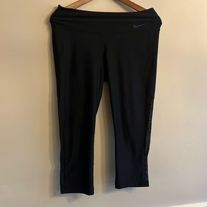 Women’s black Nike Dri Fit capri legging with partly sheer calve Medium
